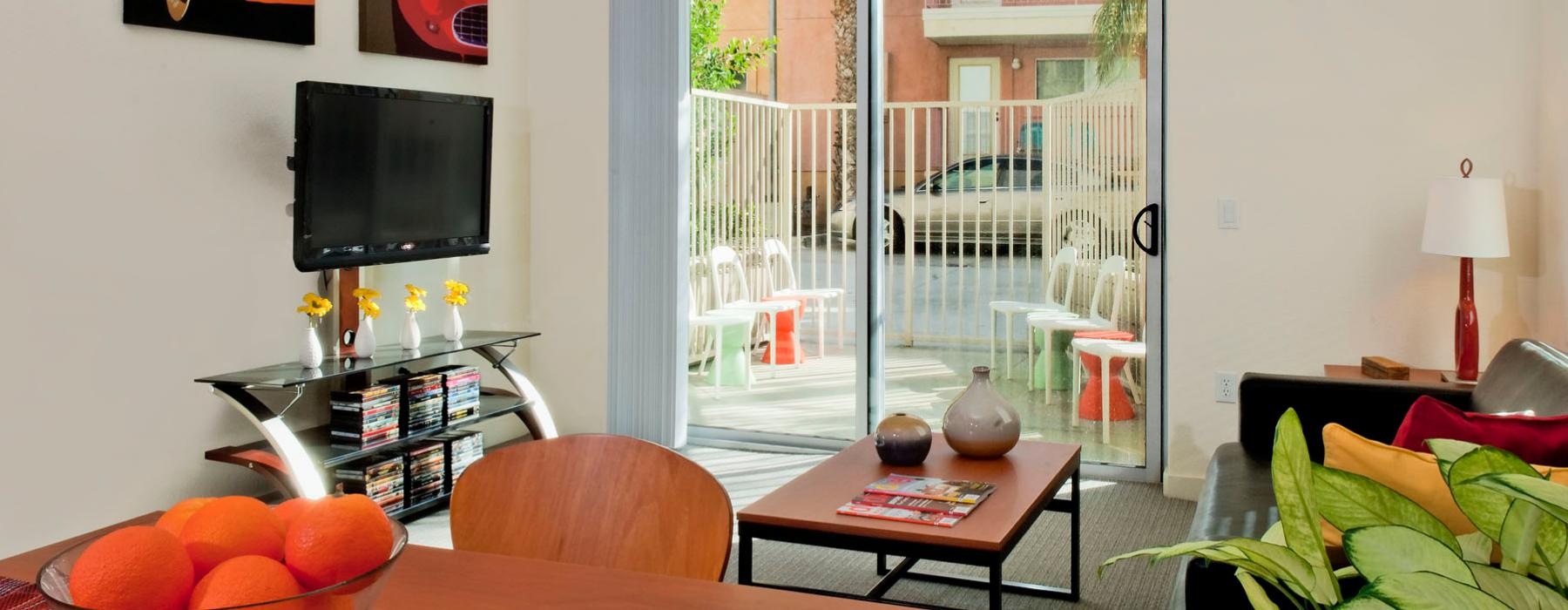 a living room with a tv and a table